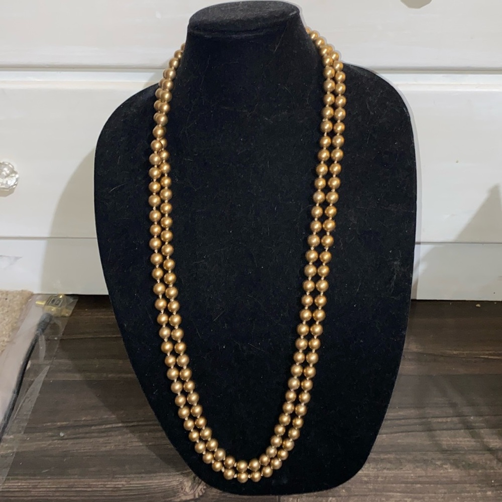 Long strands of beads . Easily can have 3 different lengths he and looks